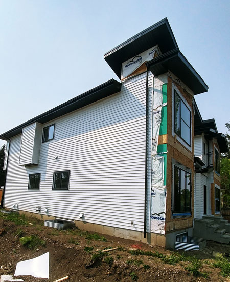 Siding installation for new home construction in Edmonton and Calgary.